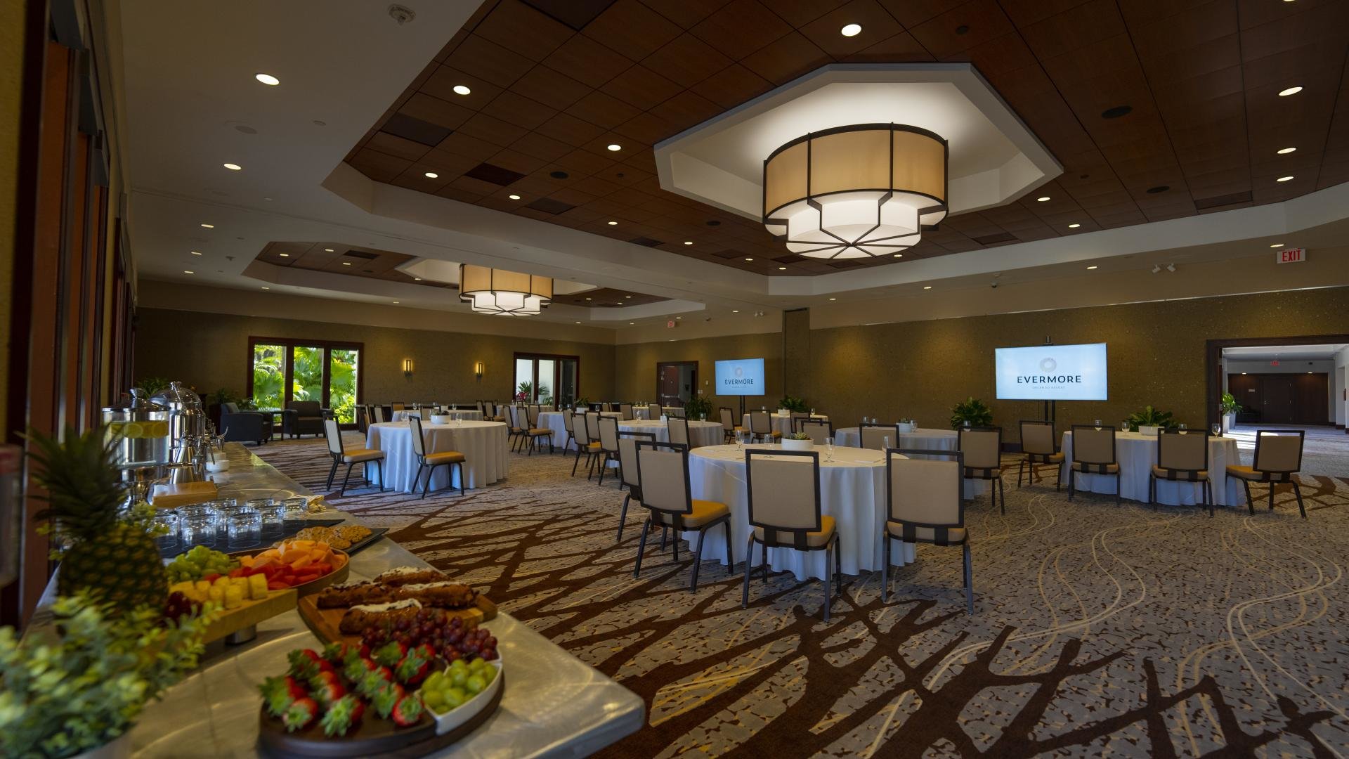 evermore large event room with table and chairs and food